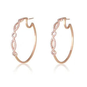 Cosmopolitan adorned hoop earrings with diamond pave geometrical patterns