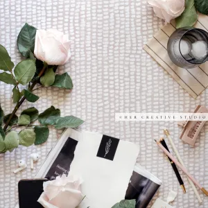 Roses & Pencils on Patterned Tablecloth, Stock Image
