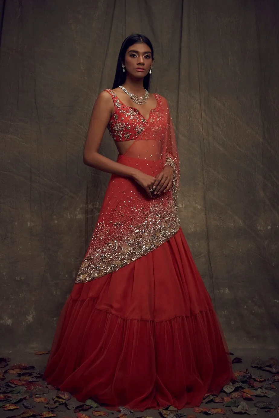 Rust Embellished Lehenga and Sleeveless Blouse