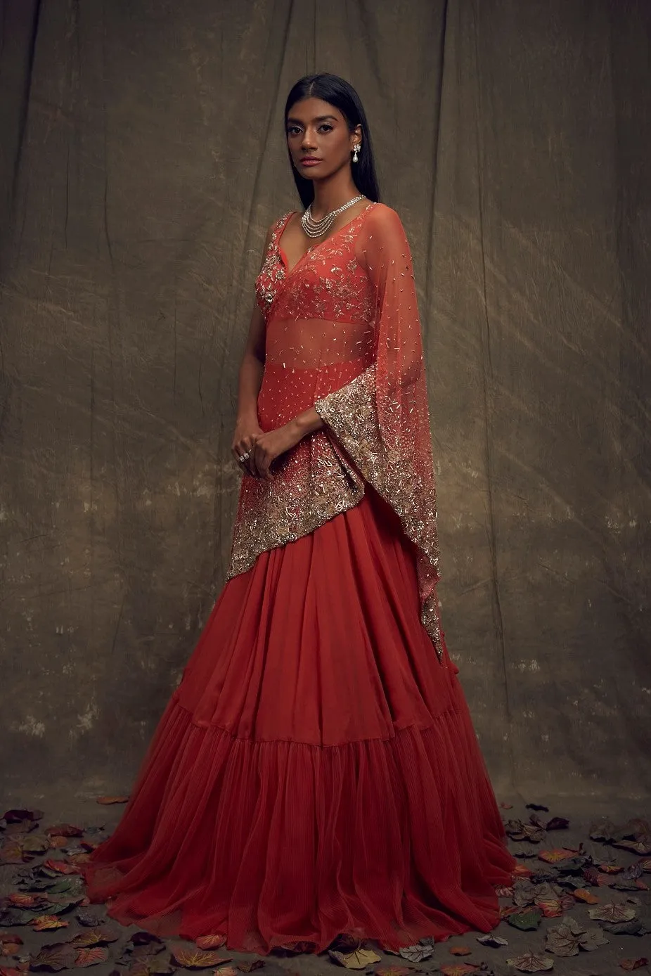 Rust Embellished Lehenga and Sleeveless Blouse