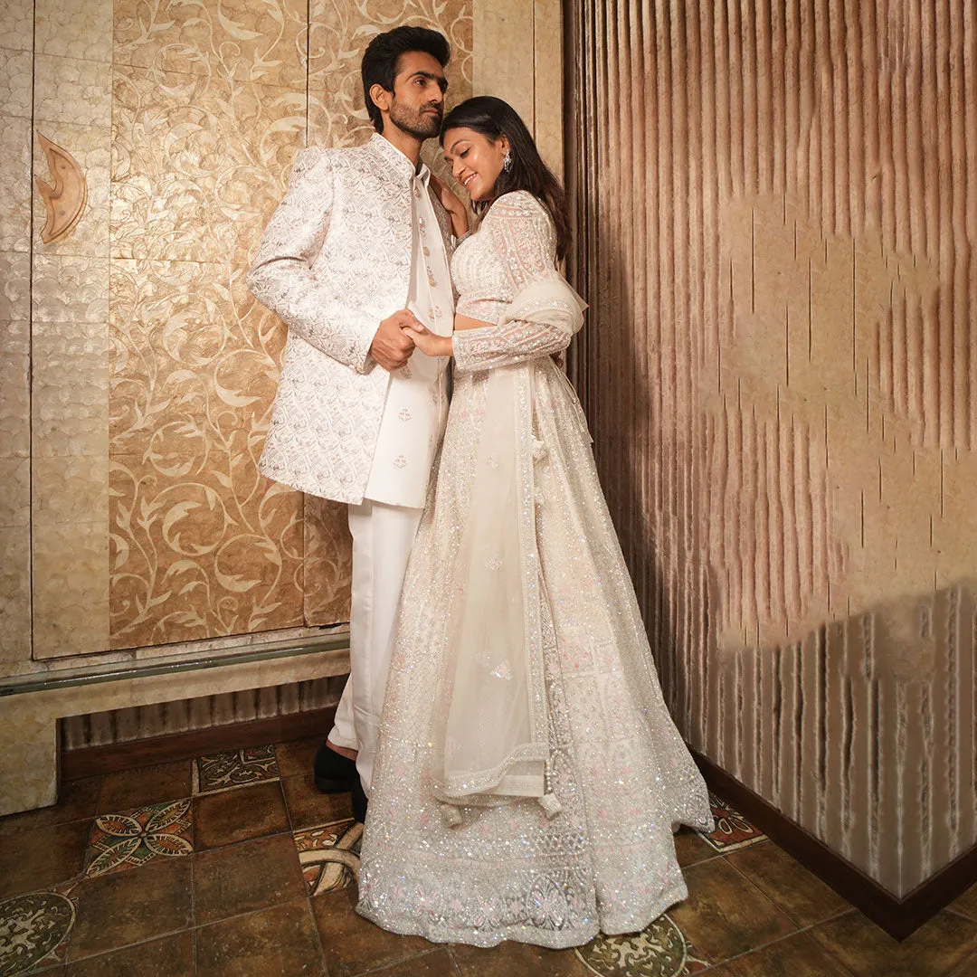 Twinning White Silhouette Sherwani for Men Paired with Lehenga Set for Women