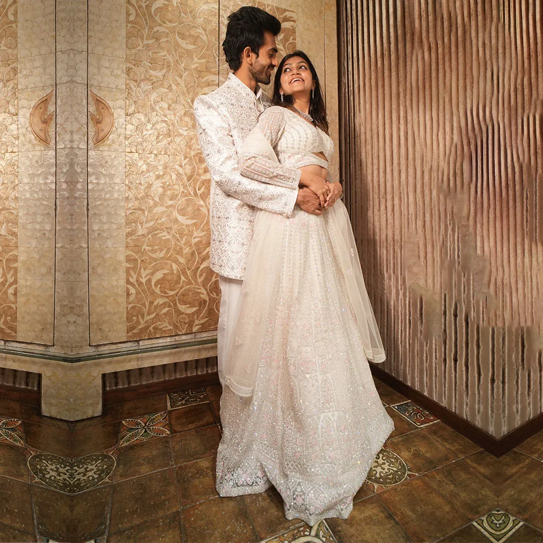 Twinning White Silhouette Sherwani for Men Paired with Lehenga Set for Women